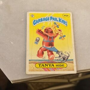 Garbage Pail Kids Tanya Hide Trading Card - Red and Yellow